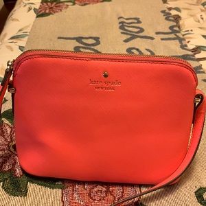 Crossbody bag by Kate Spade. Orange. Almost new. Used once. Clean